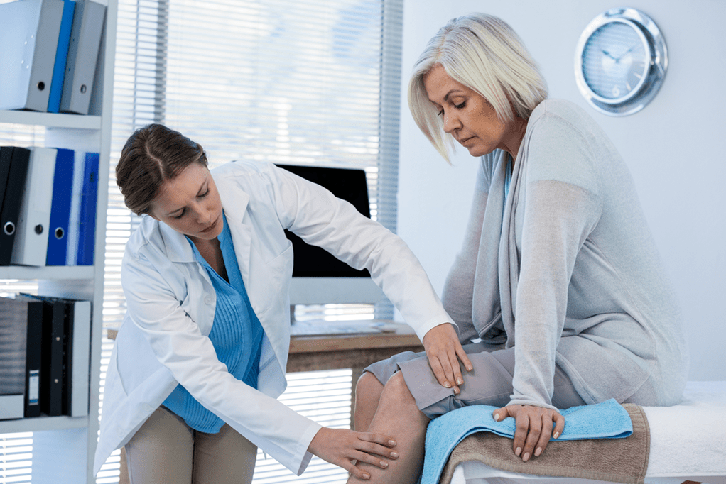 A patient with arthritis being examined by a doctor